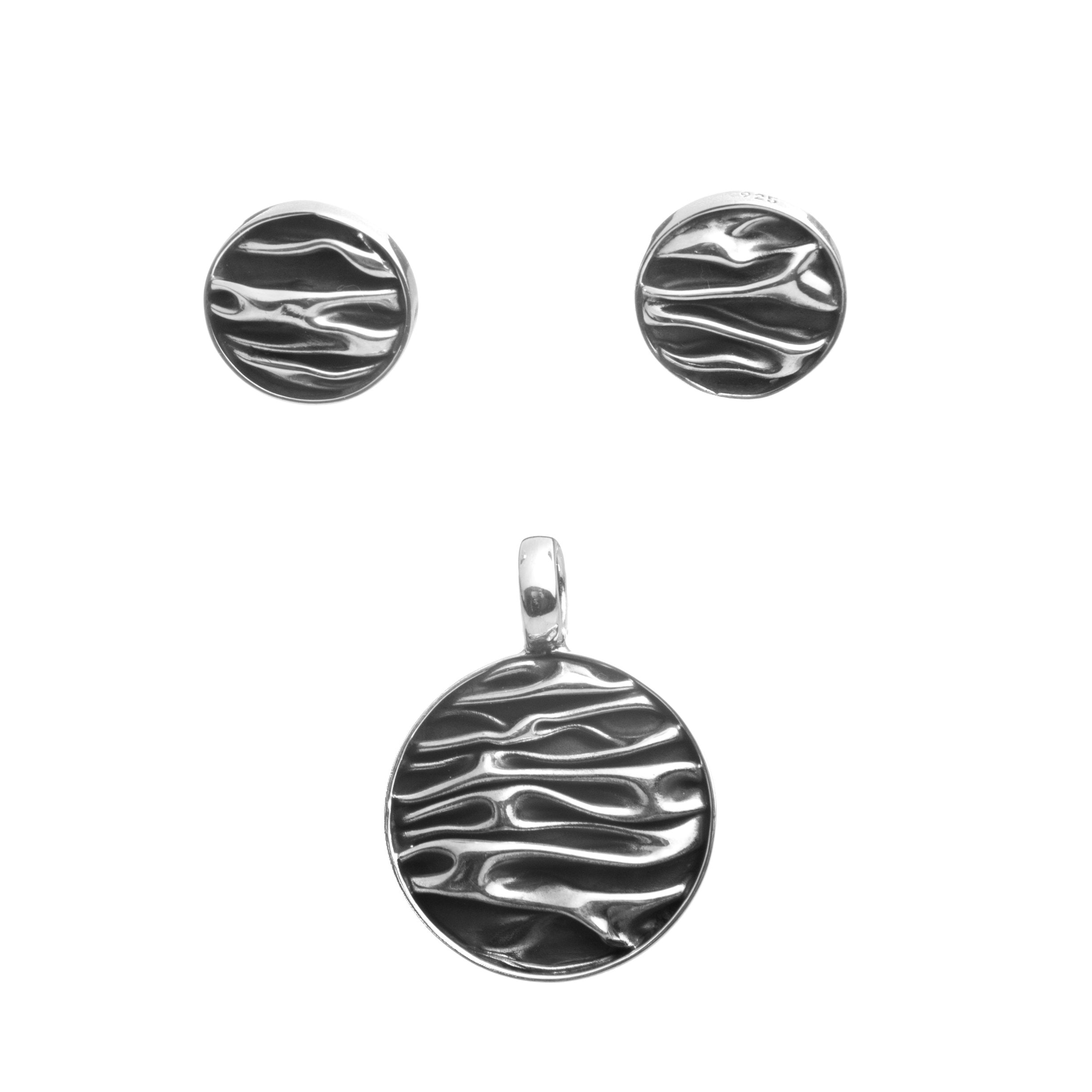 Aretes y dije circular de plata pavonada