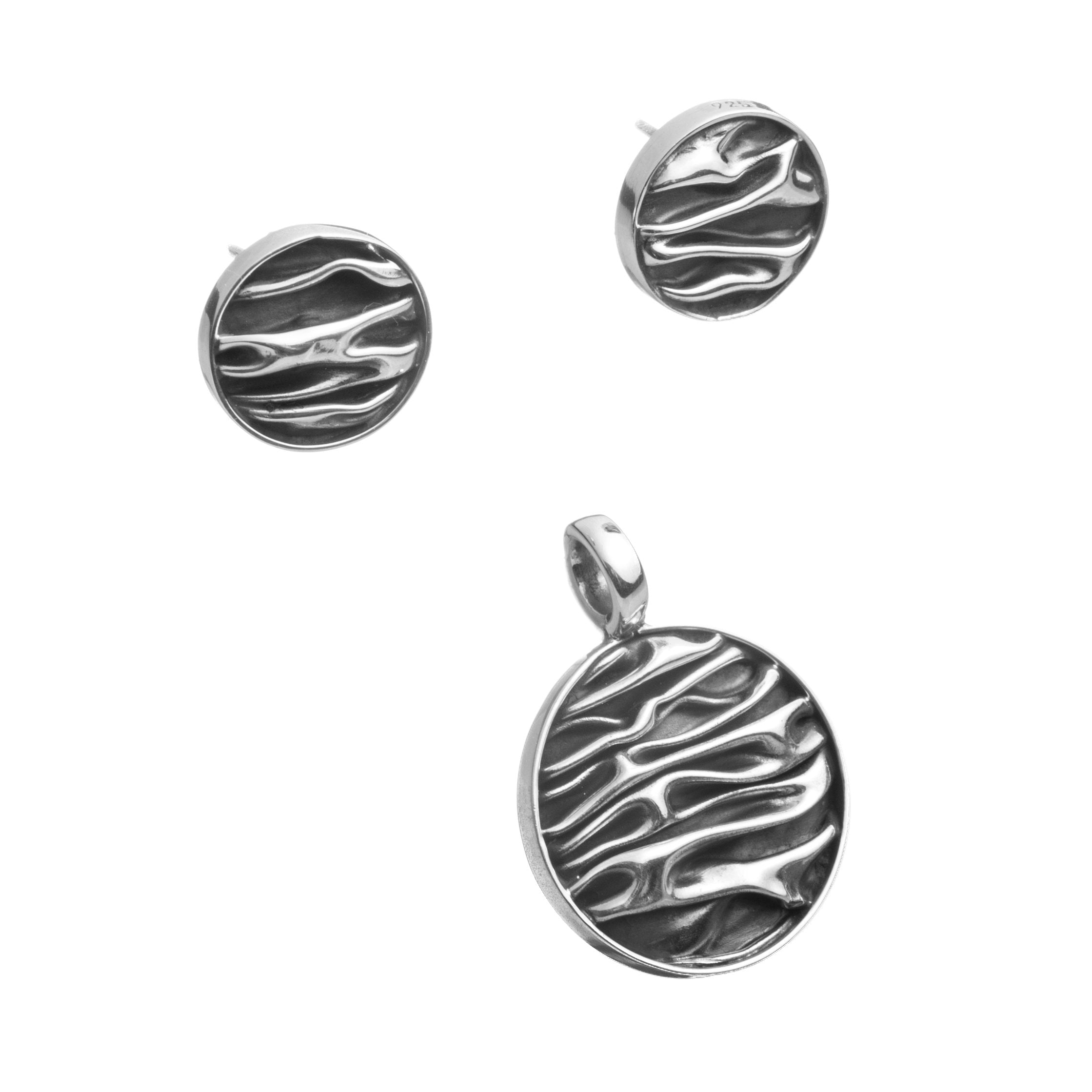 Aretes y dije circular de plata pavonada