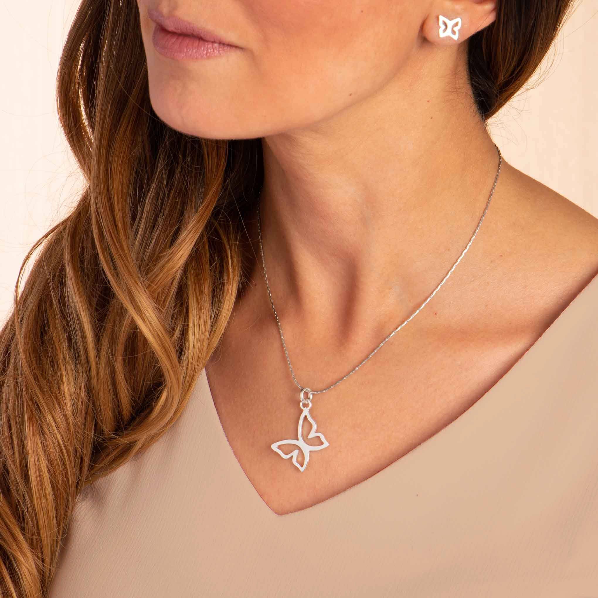 Dije y aretes de mariposa Cloé en contorno de Plata