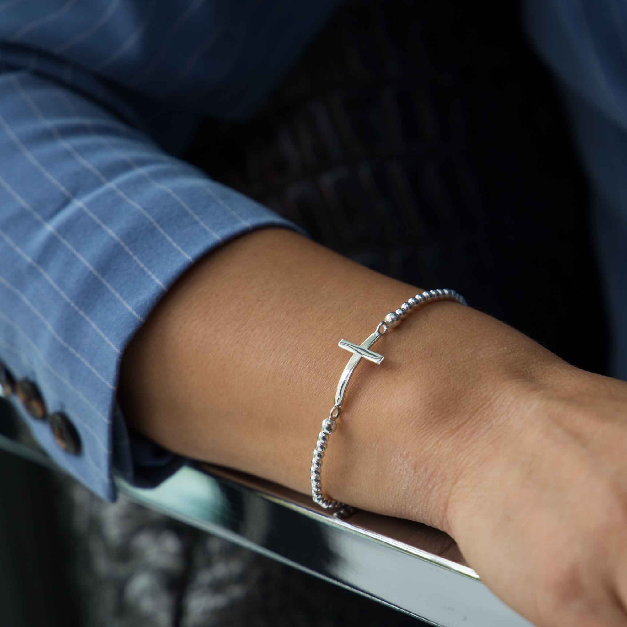 Pulsera elástica cruz de Plata.
